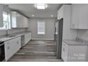 Spacious kitchen with stainless steel appliances, granite countertops, and modern wood-look flooring at 602 Still St # 1 Blk C, Chester, SC 29706