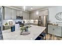 Bright kitchen with stainless appliances, granite countertops, island seating and modern backsplash at 6266 Tea Olive Dr # 238, Harrisburg, NC 28075