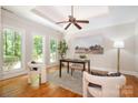 Bright home office with natural light, custom ceiling, and neutral color palette at 6868 St Peters Ln, Matthews, NC 28105