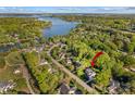 Scenic aerial view of a neighborhood home near a beautiful lake surrounded by lush greenery at 7896 Harbor Master Ct, Denver, NC 28037