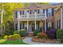 Charming brick home showcasing a welcoming front entrance with landscaped garden and manicured walkway at 7896 Harbor Master Ct, Denver, NC 28037