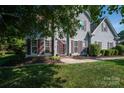 Traditional two-story home with a well-kept lawn and lovely landscaping. Perfect for families at 7905 Sedgebrook E Dr, Stanley, NC 28164