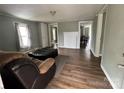 Inviting living room featuring a faux fireplace and wood flooring, with great natural light at 1025 Martin Luther King Jr Dr, Albemarle, NC 28001