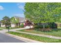 Lovely home with well-manicured lawn, mature trees, and attractive landscaping enhancing curb appeal at 11008 Round Rock Rd, Charlotte, NC 28277
