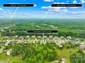 Aerial view of neighborhood showcasing lush green trees with a convenient location at 1128 Rosecliff Dr, Marvin, NC 28173