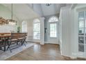 Bright dining room boasting high ceilings, large windows, and a modern light fixture at 1342 Crown Ridge Dr # 38, Fort Mill, SC 29708