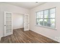 Bright office space featuring French doors, hardwood floors and a large window at 138 Maritime St, Mooresville, NC 28117