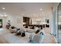 Bright living room showcasing stylish furniture, a ceiling fan, and views of the kitchen, great for entertaining at 1807 Arnold Dr, Charlotte, NC 28205