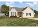 Lovely single-story home showcasing a manicured lawn and charming curb appeal at 206 Summey Barker Dr, Dallas, NC 28034