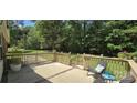 Relaxing outdoor space featuring a cozy back deck with ample seating and a serene backyard view at 307 Aquarius Dr, Clover, SC 29710