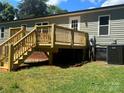 Newly constructed back deck with stairs to the yard at 353 Quail Pointe Dr, Salisbury, NC 28147