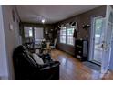 Inviting dining area with hardwood floors, glass table set, and ample natural light at 515 Upper Spencer Mountain Rd, Stanley, NC 28164