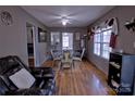 Cozy dining area with hardwood floors, chandelier, and a view into another room at 515 Upper Spencer Mountain Rd, Stanley, NC 28164