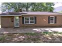 Charming brick home featuring classic window shutters and a welcoming front entrance at 515 Upper Spencer Mountain Rd, Stanley, NC 28164