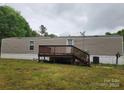 View of back of home with spacious deck and yard at 544 Bentley Rd, Shelby, NC 28152