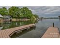 A wooden dock on the lake provides access to the water, with boat slips and scenic views at 7942 Vista View Dr, Sherrills Ford, NC 28673