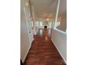 Spacious living room featuring hardwood floors and a cozy fireplace at 978 Stinson Glen Ln, Charlotte, NC 28214