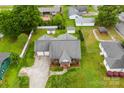 Aerial view of home featuring a well-maintained lawn and mature trees in a neighborhood at 102 Sussex Ave, Cherryville, NC 28021