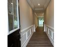 Inviting hallway with elegant molding, hardwood floors, and recessed lighting at 12033 Lavinia Ln, Charlotte, NC 28277