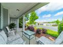 Inviting front porch with comfortable seating and views of the neighborhood at 13360 Old Compton Ct, Pineville, NC 28134