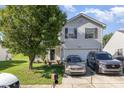 Charming two-story home with a well-maintained lawn and a two-car garage at 1346 Mandy Place Ct, Charlotte, NC 28216