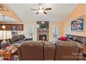 An open-concept living room features a beautiful stone fireplace and flows seamlessly into the kitchen at 1534 Buffalo Shoals Rd, Lincolnton, NC 28092