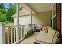 Relax on this cozy porch with comfortable seating, perfect for enjoying peaceful outdoor moments at 1534 Buffalo Shoals Rd, Lincolnton, NC 28092