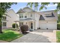 Two-story home with an attached two-car garage and manicured lawn at 18027 Train Station Dr, Cornelius, NC 28031