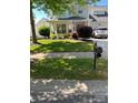 Well-maintained front yard with lush landscaping and inviting curb appeal at 18027 Train Station Dr, Cornelius, NC 28031