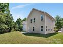 Large backyard with mature trees surrounding the home at 2751 Bramble Ridge Ct, Charlotte, NC 28215