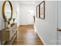Bright entryway showcases hardwood floors and elegant decor at 414 Janie Nw Cir, Newton, NC 28658