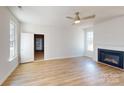 Spacious main bedroom with fireplace, ensuite bathroom, and two windows for natural light at 9612 Pointer Rd # 59, Huntersville, NC 28078