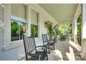 Spacious porch featuring rocking chairs and views of the greenery at 117 Mills Ln, Fort Mill, SC 29708