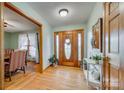 Inviting entryway with hardwood floors, wooden door with sidelights, and stylish decor at 1221 Edgefield Rd, York, SC 29745