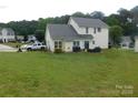 Spacious backyard with lush green grass, perfect for outdoor activities at 12803 Matisse Ln, Charlotte, NC 28215