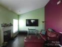 Cozy living room featuring a fireplace and comfortable seating at 12803 Matisse Ln, Charlotte, NC 28215