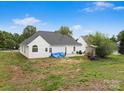 Spacious backyard with open patio area offering a great space for outdoor entertaining at 1579 Matthews Dr, Rock Hill, SC 29732