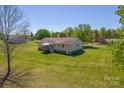 Expansive backyard with a private deck, perfect for outdoor entertaining and relaxation at 174 Stewart Acres Dr, Statesville, NC 28677