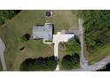 Aerial view of the home with a large yard, long driveway, and a detached two-car garage at 260 Treebark Rd, Statesville, NC 28625