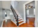 Classic staircase design with dark wood handrail and open floorplan concept at 309 N Congress N St, York, SC 29745
