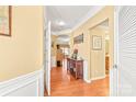 Bright foyer featuring gleaming hardwood floors, elegant trim, and an open layout at 44449 Oriole Dr # 101, Indian Land, SC 29707