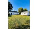 Expansive backyard featuring both the main house and a detached building, perfect for outdoor activities at 716 E Union St, Marshville, NC 28103