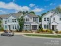 Charming two-story home with blue siding, white trim, and landscaped front yard on a sunny day at 804 Lyndon Station Dr, Pineville, NC 28134