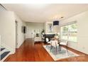 Cozy dining room with fireplace, and a large window to let in sunlight at 8233 Christmas Ct, Charlotte, NC 28216