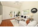 Bright living room with high ceilings, fireplace, and access to the backyard patio at 8233 Christmas Ct, Charlotte, NC 28216