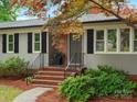 Close-up of a home's front entrance with brick steps, black door and matching shutters at 981 Meadowlark Dr, Rock Hill, SC 29732