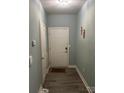 Entryway with wood-look flooring and light-colored walls for a welcoming feel at 9843 Hyde Glen Ct, Charlotte, NC 28262