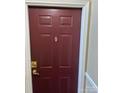 Exterior front door featuring a decorative knocker, offering security and style at 9843 Hyde Glen Ct, Charlotte, NC 28262