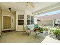 Inviting covered front porch with comfortable seating and potted plants by the front door at 1027 Feather Oak Ln, Matthews, NC 28104