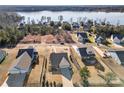 Stunning aerial view of homes nestled near a serene lake, showcasing the neighborhood's prime waterfront location at 11249 Island View Ln, Lancaster, SC 29720